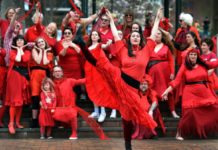 Bloke in a red dress shows the way